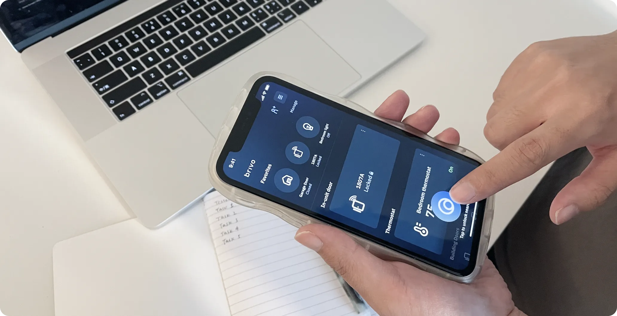 A participant tapping through the Brivo Mobile Pass prototype on a phone during a test session